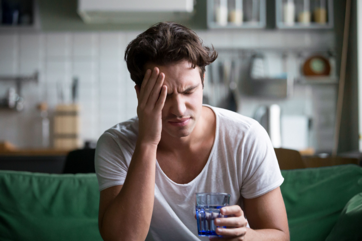 Man experiencing severe migraine