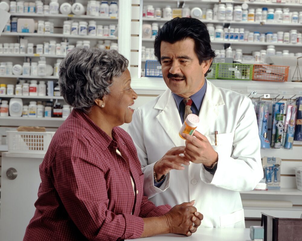 Woman talking to Pharmacist about Medication